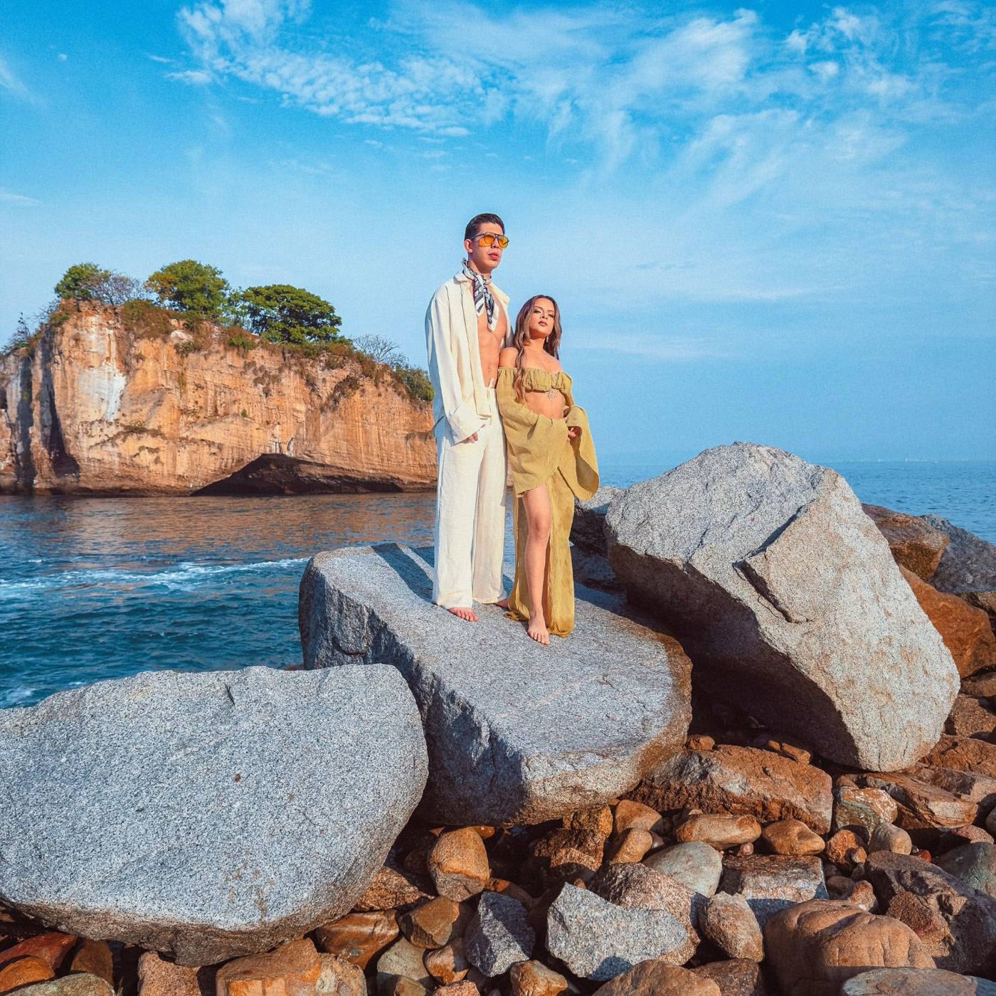 Couple photoshoot on the rocks by the ocean in Puerto Vallarta
